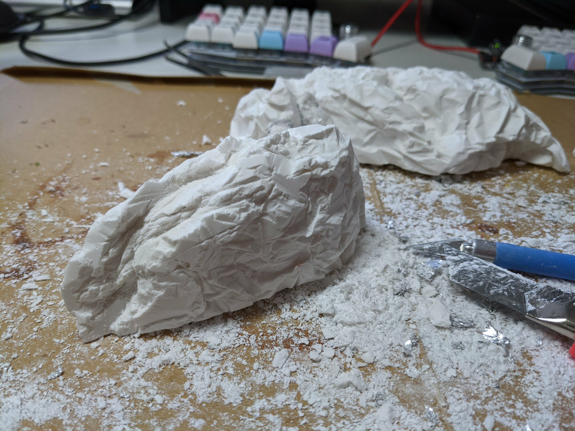 I learned the plaster sticks to aluminium foil quite well. It was tedious to remove it. I also spent some time improving the result with a knife.