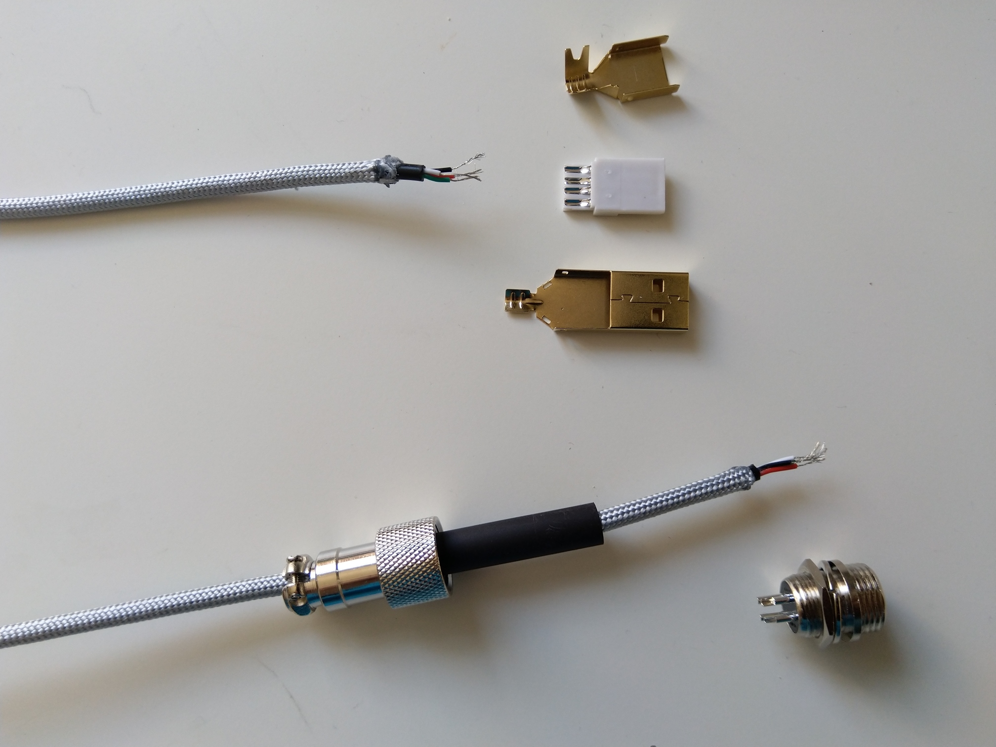 The longer piece of cable and its connectors. It's a bit harder to sleeve a longer piece of cable. Just take your time.